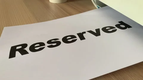 Printing “Reserved” text written on paper A4 sheet document on desk Video stock 179267895