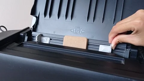 Printing on a small brown paper Stock Footage 146248572