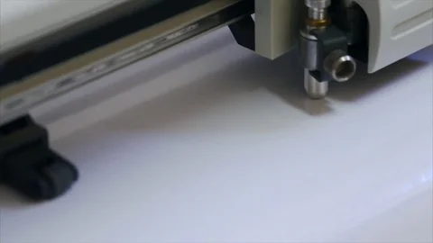 Printing stencil on self-adhesive white paper  Stock Footage 70072716