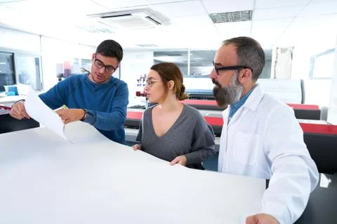 Printing team at industry plotter printer Fotos de archivo