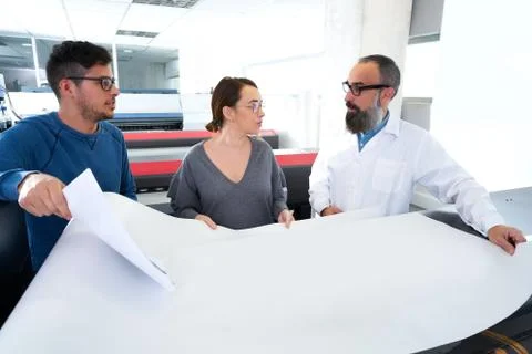 Printing team at industry plotter printer Fotos de archivo