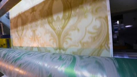 Printing on wallpaper, the process of printing wallpaper using a printing press Stock Footage 107912768