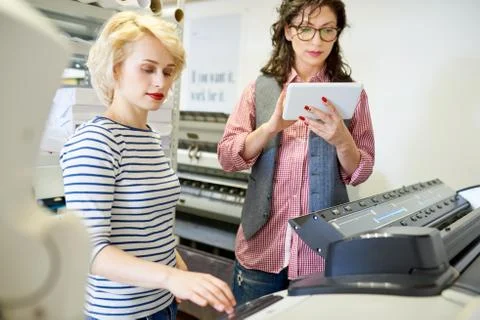 Printshop Operators Using Plotter Stock Photos