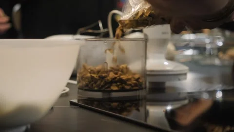 Prior to baking, it is essential to utilize a food processor for nut preparation Stock Footage 278155688