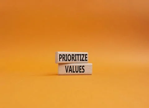 Prioritize values symbol. Concept word Prioritize values on wooden blocks. .. Foto stock