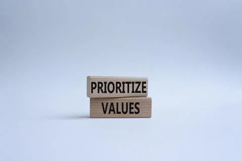 Prioritize values symbol. Concept word Prioritize values on wooden blocks. .. Foto stock