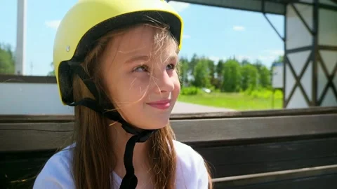 Prioritizing Safety - Before Going For A Ride, Little Girl One Puts On His Bicyc Stock Footage 280859863