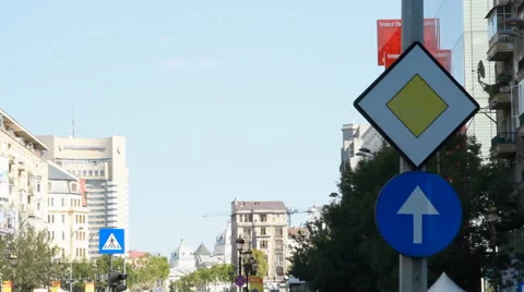 Priority And Just Ahead Sign, Traffic, Street Sign, Urban Setting, Pan Stock Footage 43233420