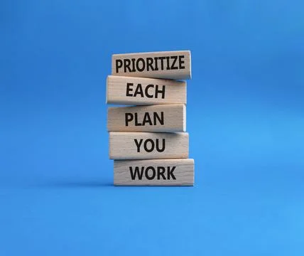 Priority, plan and work symbol. Wooden blocks with words Prioritize each pl.. Stock Photos