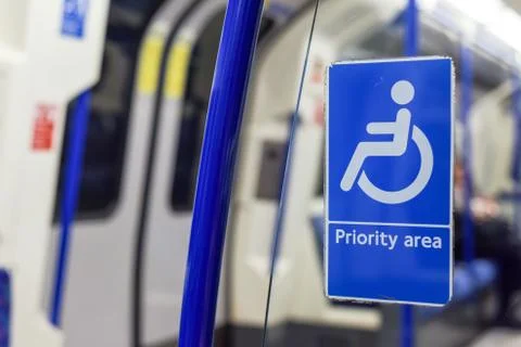 Priority seating area for people using wheelchair or with a disability on pub Stock Photos