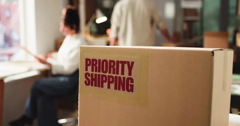 Priority shipping, box label and ecommerce office for expedited parcel, supply Stock Footage 321051091