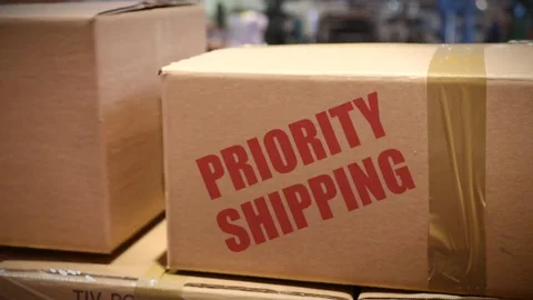Priority Shipping cartons at logistics center Stock Footage 72672259