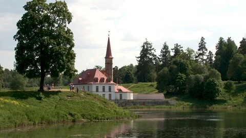 Priory Palace or Castle in Gatchina is reflected in water of Lake Black. Stock Footage 124519702