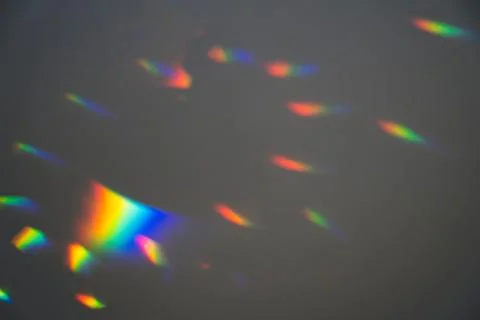 Prism Rainbow Specs on Grey Background Overlay Stock Photos