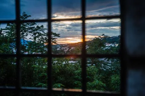 Prison bars and dramatic colorful sunset Fotos de archivo