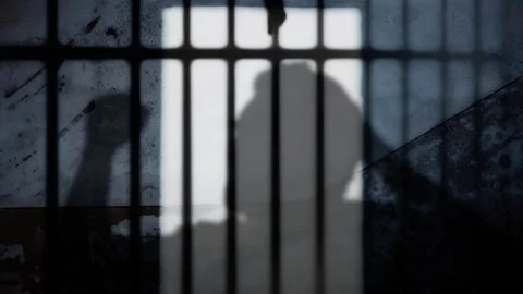 Prison bars man headphone dance cu 스톡 동영상 267096105