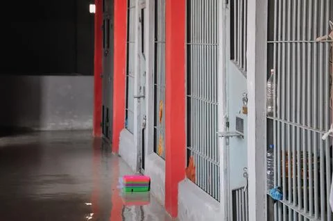Prison building hallway consisting of many rooms Stock Photos