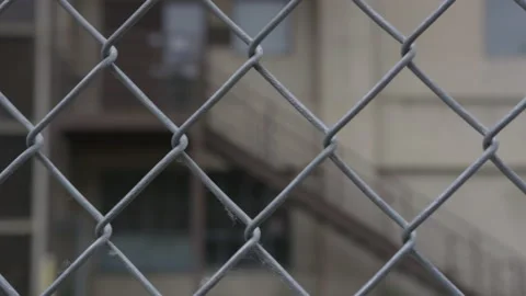 Prison Building Through Chainlink Fence Stock Footage 208708090