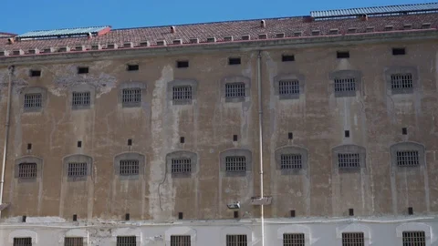 Prison building wall with bars on the windows. Stock Footage 122296887