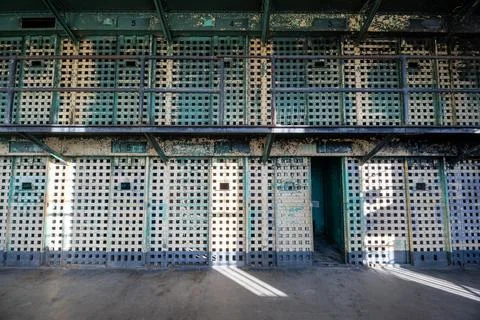 A prison cell block with bars on the windows Stock Photos