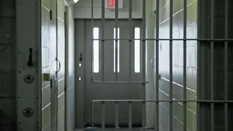 Prison cell door automatically closing in female correctional facility Stock Footage 331603363