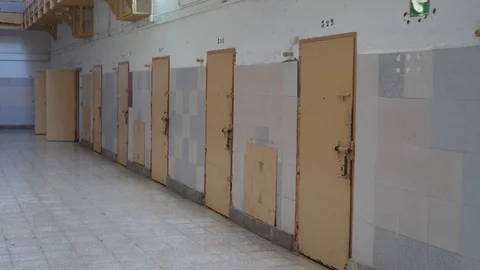Prison cell doors, view from the corridor Stock Footage 120039498