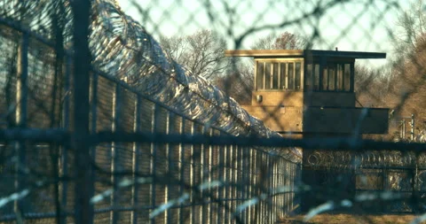 Prison, correctional facility exterior, Pan up to Gaurd tower. Stock Footage 143760145