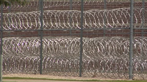 Prison, CU coils of razor wire full screen Stock Footage 41313317