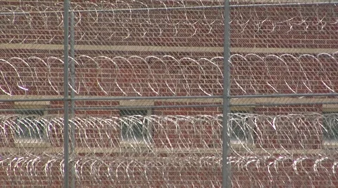 Prison, Federal 4 stack coils razor wire full screen Stock-Footage 41311956