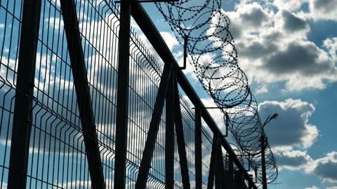 Prison fence with barbed wire Video stock 137501485