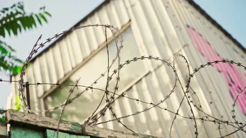 Prison fence. Barbed wire. View at the barb wall of the crime area. Stock Footage 170457408