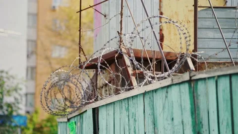 Prison fence. Barbed wire. View at the barb wall of the crime area. Stock Footage 170457415