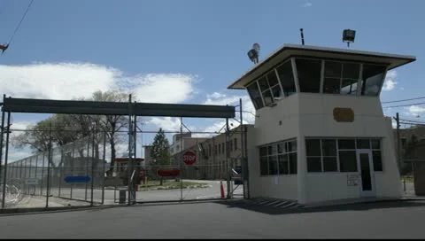 Prison Gates with generic guard tower on beautiful sunny day, 888 Stock Footage