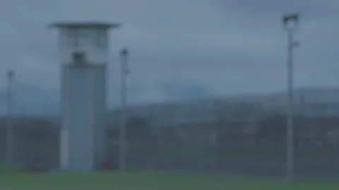 Prison Guard and Barbed Wired Fence, Overcast Day, Focus Rack Stock Footage 91273273