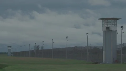 Prison Guard Tower and Barbed Wires, with Fast Moving Clouds, Timelapse Stock Footage 91273300