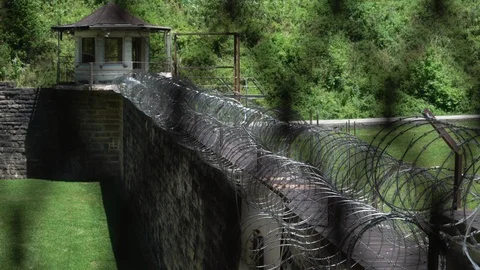 Prison Guard Tower and Razor Wire at Correction Facility Stock-Footage 107608957