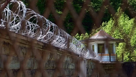 Prison Guard Tower and Razor Wire at Correction Facility Видео 107612009