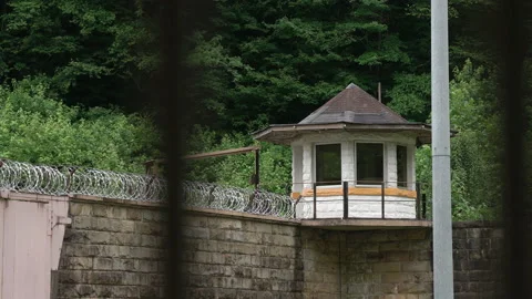 Prison Guard Tower with Razor Wire on Jail Wall Stock Footage 133562742