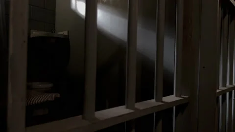 Prison jail cell bars moody cinematic Stock Footage 225201264