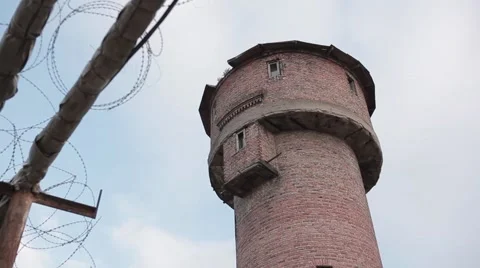 Prison lookout tower barbed wire Stock Footage 49071324