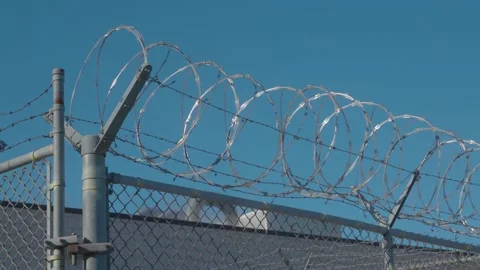 Prison Razor Wire and Fences with Steam ... | Stock Video | Pond5