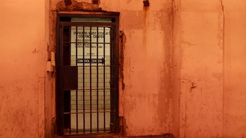 Prison rules and regulations with cement cell and bars in foreground. Vídeo Stock 106533352