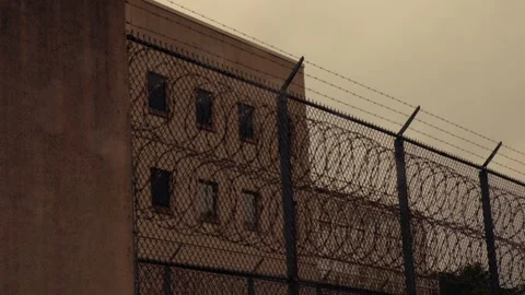 Prison Walls Exterior | Barbed Wire and Chain Link Fencing Stock Footage 315530242