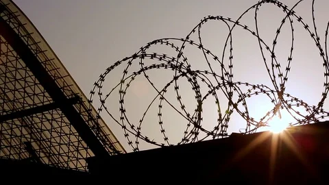 Prison wire at sunset Vidéo 76441983
