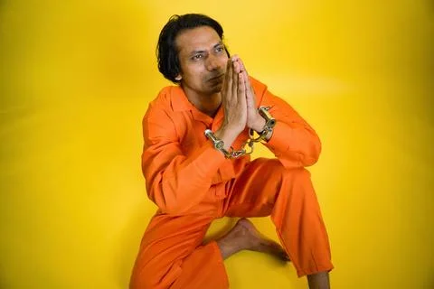 A prisoner apologizing with joining hand Stock Photos