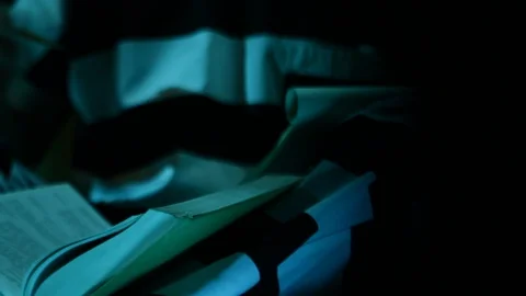 Prisoner Behind Bars Reading Large Books HD Video Stock Footage 91866259