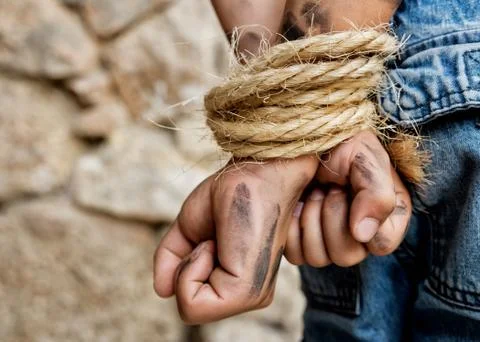 Prisoner bound with rope Stock Photos