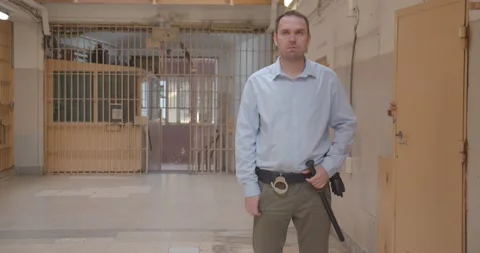 Prisoner escapes from prison cell behind back of the prison guard, funny video. Video stock 166911646
