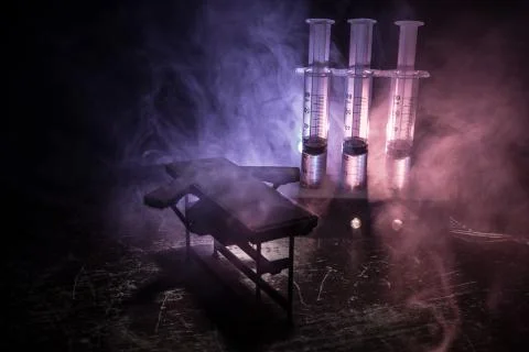Prisoner handcuffed to death by lethal injection, vial with sodium thiopental Stock Photos