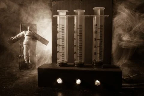 Prisoner handcuffed to death by lethal injection, vial with sodium thiopental Stock Photos